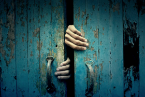 Hands Opening a Creepy Door